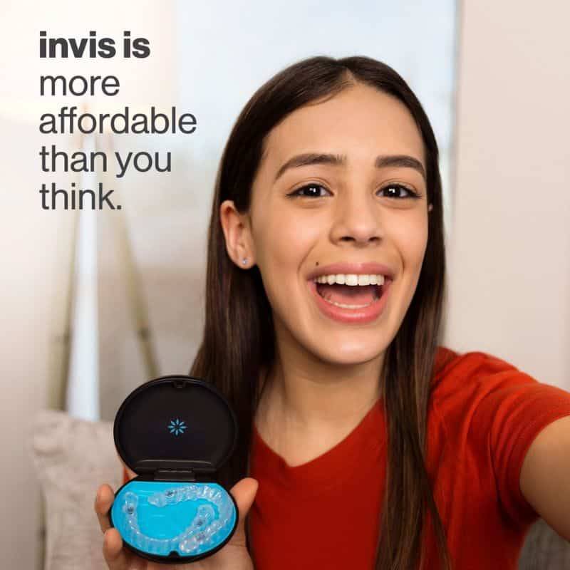 Invisalign girl holding invisalign clear aligners