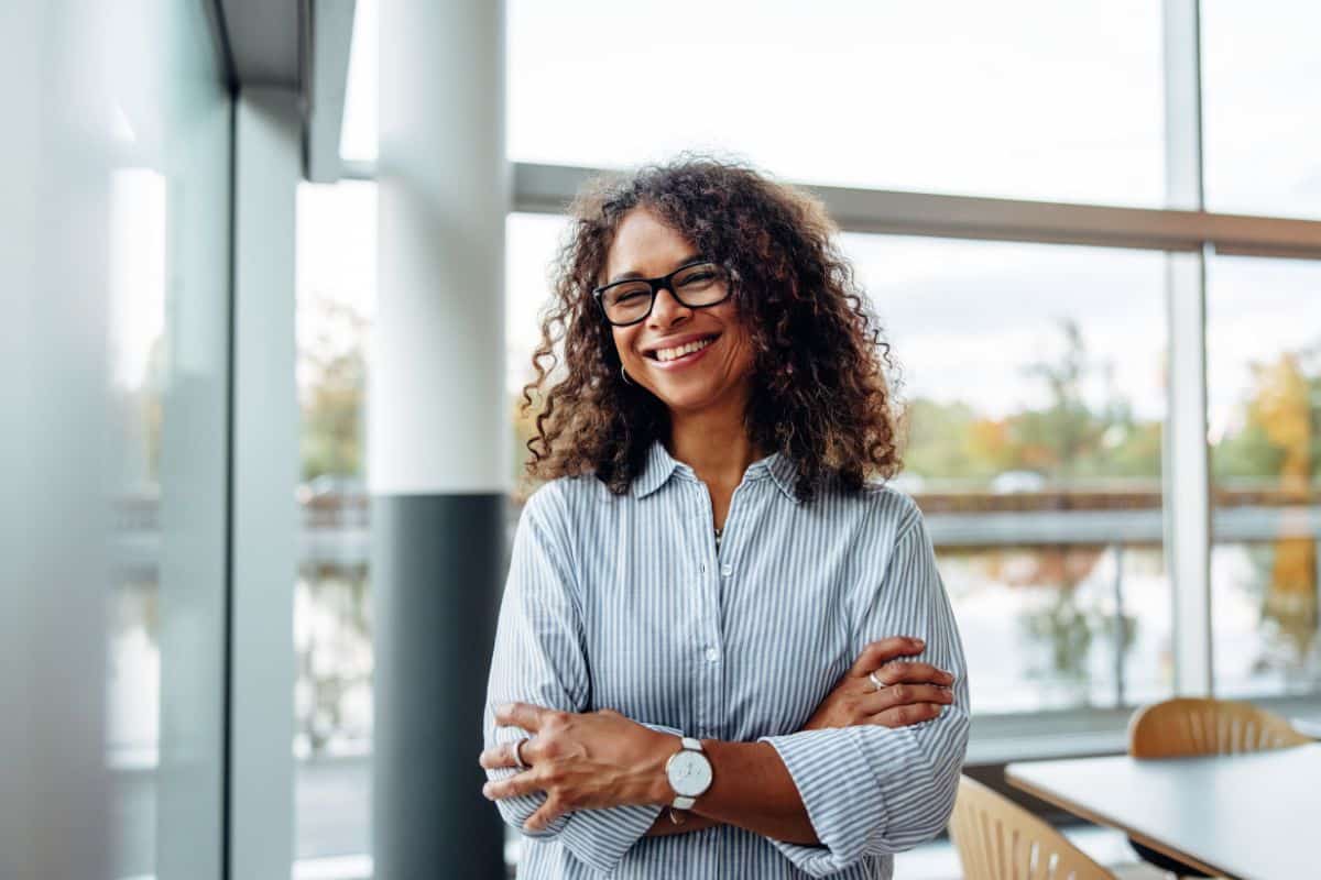 woman wearing striped shirt smiling