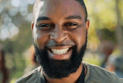 a man with a beard smiling, representing dental implants in Lansdowne VA
