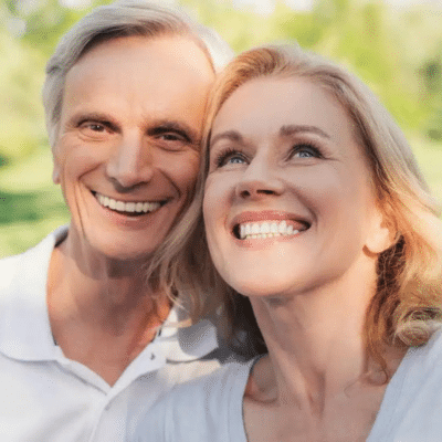 A man and woman smiling, representing dental cleanings in lansdowne va