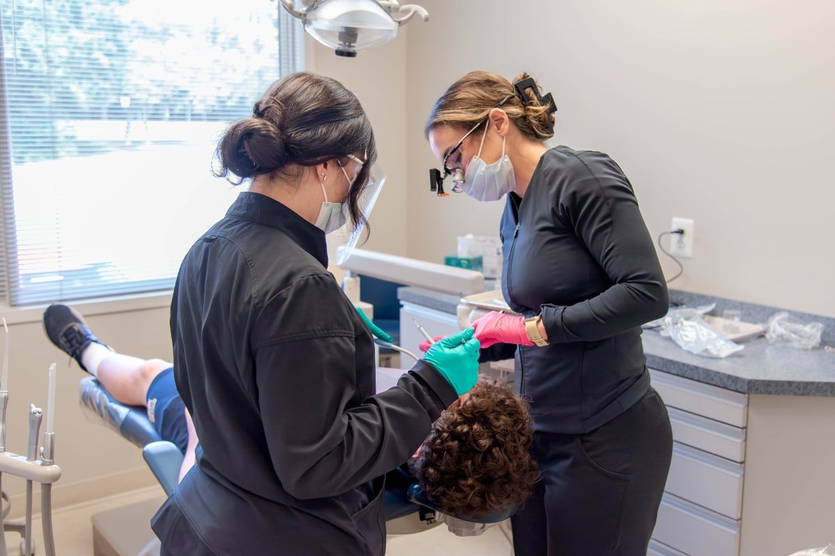 Invisalign provider in lansdowne, va performing clear aligner treatment at lansdowne dentistry by design