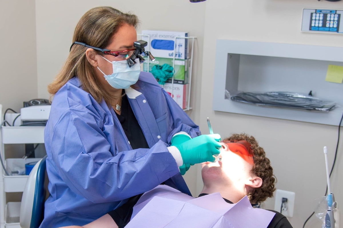 Dentist performing advanced cosmetic dental treatment on patient at Lansdowne Dentistry By Design in Lansdowne, VA