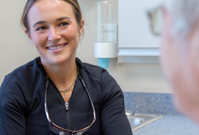 Dr. Brandi Coyle meeting with a patient at Lansdowne Dentistry By Design, representing what to expect at your first dental visit
