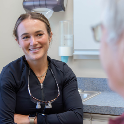 Dr. Brandi coyle meeting with a patient at lansdowne dentistry by design, representing what to expect at your first dental visit