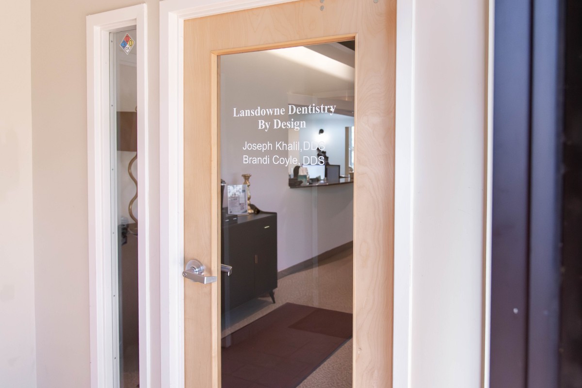 Entrance door to lansdowne dentistry by design in leesburg, va, where patients receive family, cosmetic, and restorative dental care.
