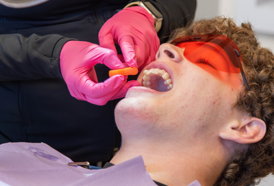 Patient receiving a dental exam and check-up at Lansdowne Dentistry by Design in Lansdowne, VA, representing dental check-up questions